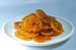 Savoring Sweet India a plate of food on a white surface